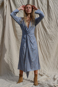 dress shown worn tied at the back, showing the twist front detail at the waist