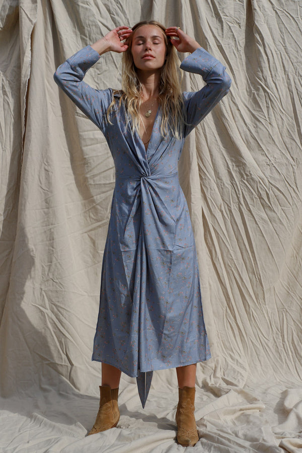 dress shown worn tied at the back, showing the twist front detail at the waist